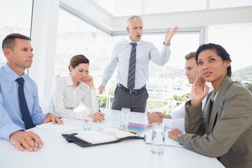Businessman yelling at his team