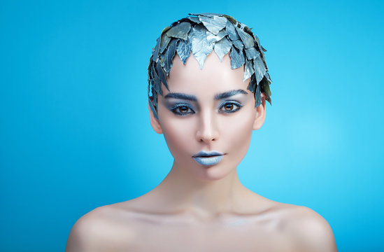 frozen woman and silver leaves on head