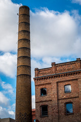 Fototapeta premium Old brown house with a chimney