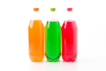 Bottles with soft drinks, isolated on a white background