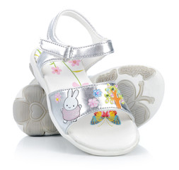 Silver sandals for a little girl - obrazy, fototapety, plakaty