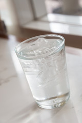 Glass of pure water with ice
