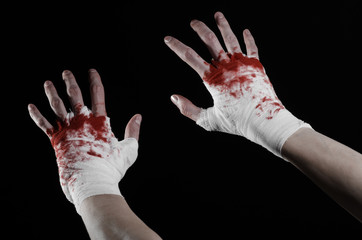 bloody hand in a bandage, bloody bandage, black background