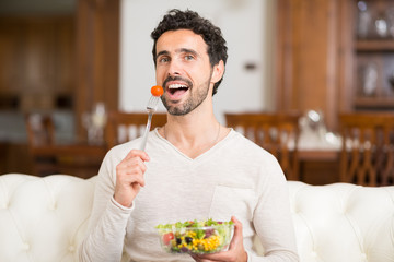 Man eating a salad © Minerva Studio
