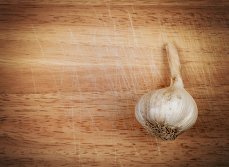 Head of garlic on a wooden board