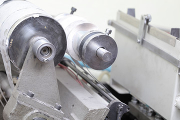 Rolling machine with paper in printing workshop