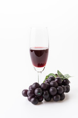 Red wine and grapes
