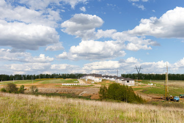 Group of houses in the countryside. Sunny summer day.