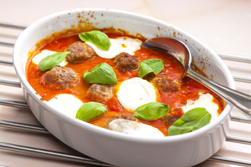 baked Bolognese balls with tomato, basil and fresh bull mozzarel