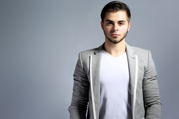 Young man on gray background