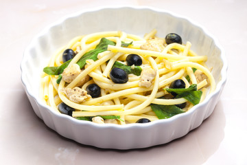 macaroni with chicken meat and black olives on sage