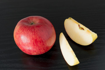 red apple on black background