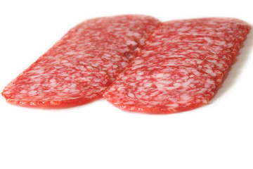 sliced salami on a white