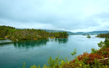 Summer cloudy fjord landscape (Norway).