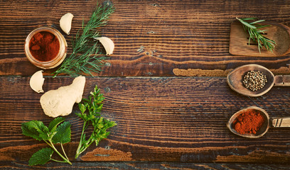 Spices and herbs on wooden table. Top view