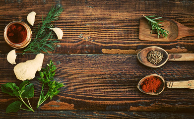 Spices and herbs on wooden table. Top view