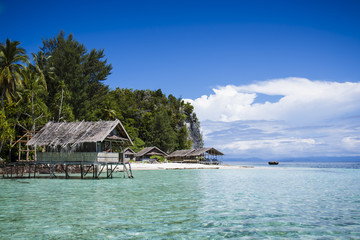 Water bungalows at west side of Kri Island in Raja Ampat