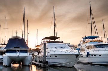 Fotobehang Yacht and boats at the marina in the evening © normalfx