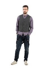 Fototapeta premium Young serious male fashion model isolated