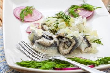 Tasty herring in pieces.