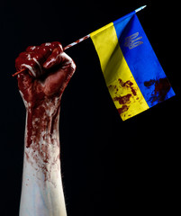 Bloody hands, the flag of Ukraine in the blood, revolution