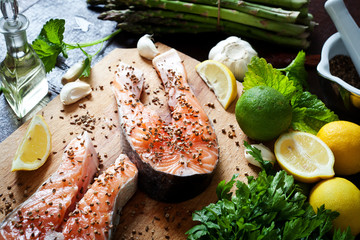 Salmon and spices on wooden table. Top view