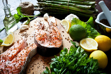 Fototapeta na wymiar Salmon and spices on wooden table. Top view