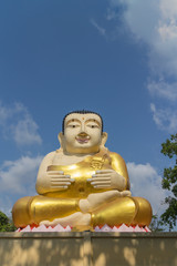 Fototapeta premium monk statue for katyayana sitting with sky background