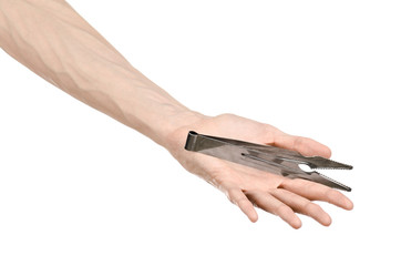 Bartender holding a hookah coal tongs on a white background