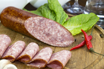 sausage on a wooden plate in a restaurant