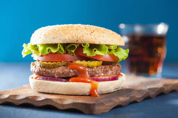 burger with beef patty lettuce onion tomato ketchup