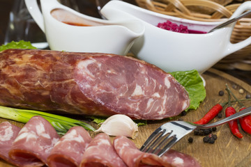 sausage on a wooden plate in a restaurant