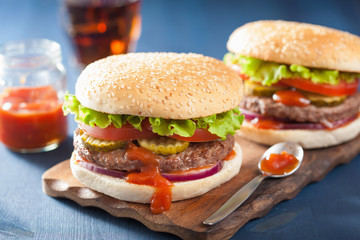 burger with beef patty lettuce onion tomato ketchup