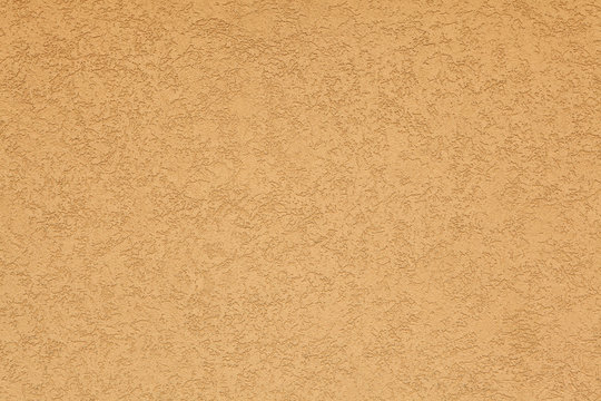 Terracotta stucco wall. Background texture.