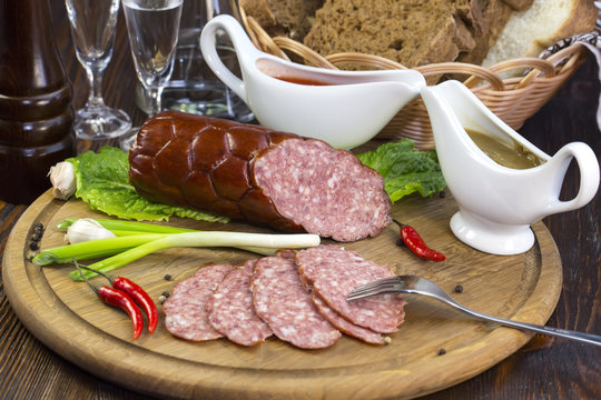 sausage on a wooden plate in a restaurant