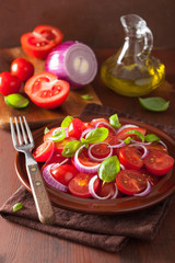 healthy tomato salad with onion basil olive oil and balsamic vin
