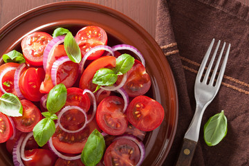 healthy tomato salad with onion basil olive oil and balsamic vin