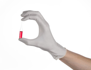 Doctor hand holding a vial, ampule red, vaccine ampule