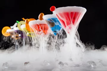 Fotobehang Cocktail with ice vapor on bar desk © Lukas Gojda
