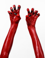 Red Devil's hands, red hands of Satan, white background isolated