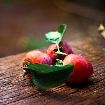 Close up of plums on wooden table
