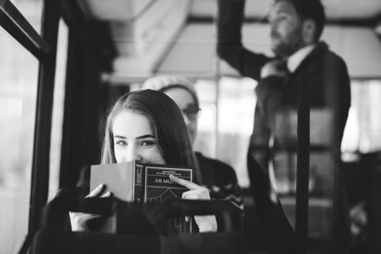 Woman on the bus reading a book