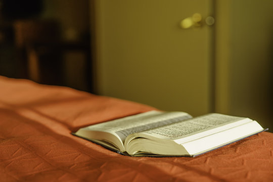 USA, Michigan, Kalamazoo County, Kalamazoo, Bible lying on bed