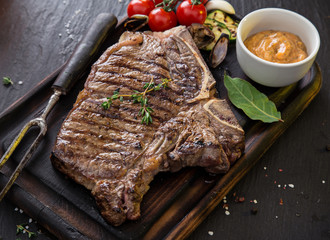 Beef steak on wooden table