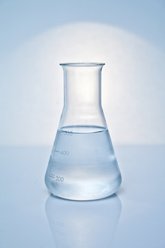 Close-up of a glass conical Flask filled with clear liquid