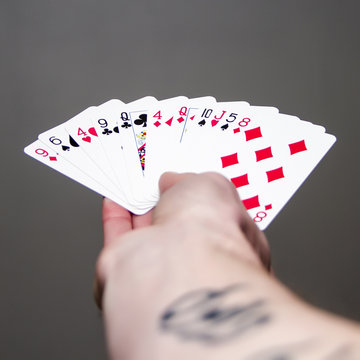 Hand holding cards