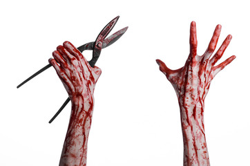 bloody hand holding a big old bloody scissors on a white backgr