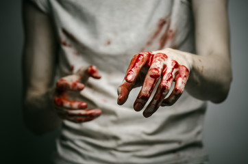 murderer shows bloody hands and experiencing depression and pain