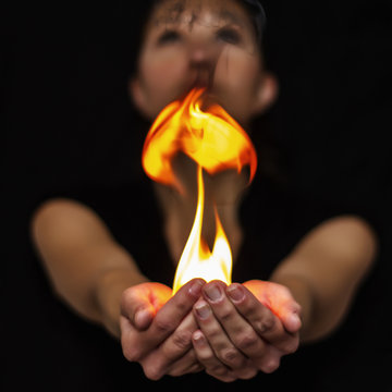 Woman holding playing with fire
