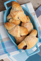 Fresh butter croissants with plum filling.